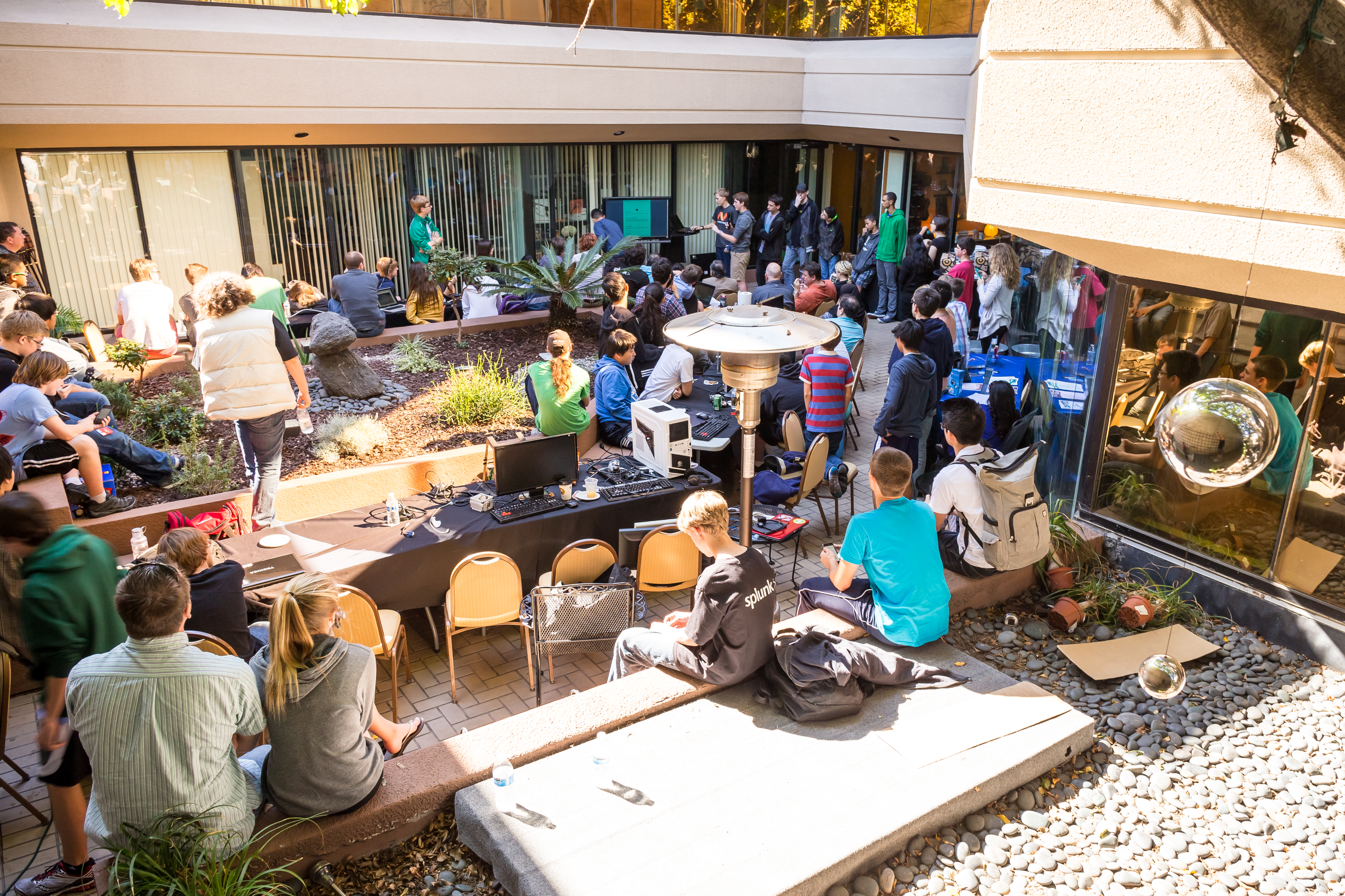 Participants gather outside for presentations. Presentations are a time for participants to show off the cool things that they were able to make during the event.